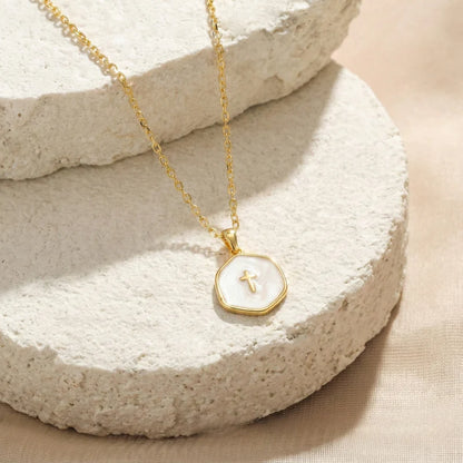 Collar Cruz Mini Perla · Fe que se lleva todos los días